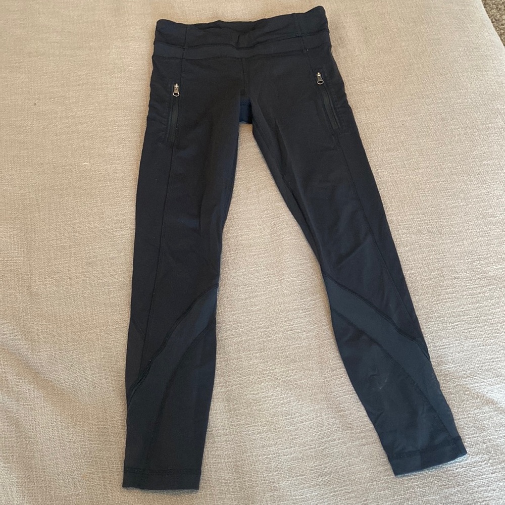 Black cropped lululemon leggings with mesh